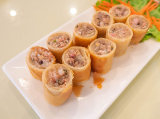 crispy spring rolls on white dish