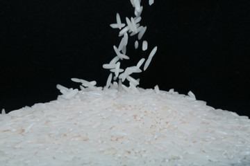 Rice Grains Falling on a pile Macro