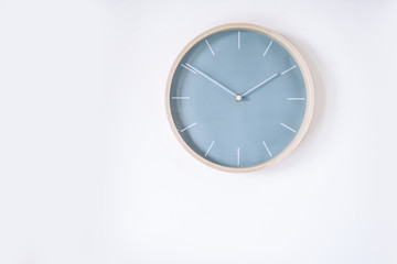 pastel blue wall clock isolated on white