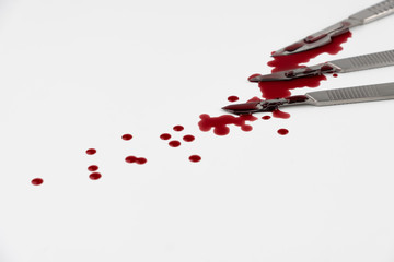 Surgical instrument tools with blood, scalpel with blade, forceps tweezers, scissors for surgeon in surgery