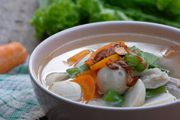 soup with meatballs and carrot served on bowl