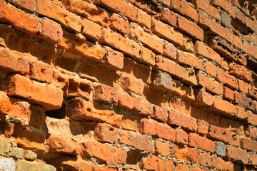 The orange wall is made of old brick
