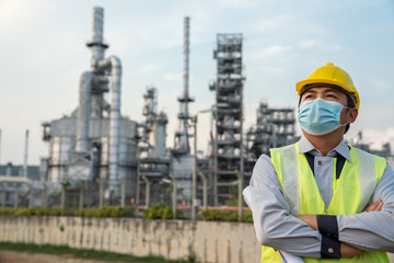 Refinery industry engineer  wearing co protective coronavirus disease starting in 2019 or Covid-19mask sading because Because of being unemployed