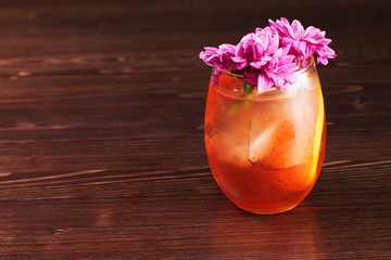 negroni cocktails at the wooden table with flower