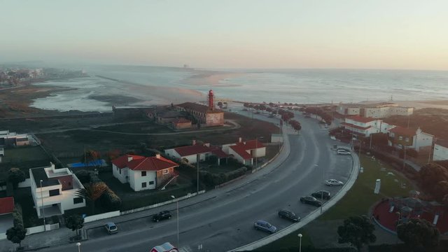 The Farol de Esposende (Esposende Lighthouse) set in front of the Fort of Sao Joao Baptista de Esposende. The two sides of Restinga de Ofir, Portugal.