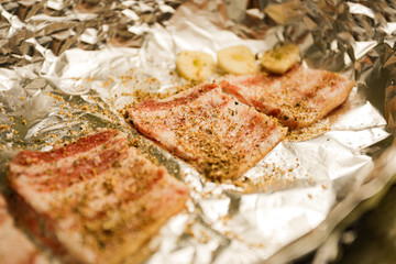 Preparation of billet, balyk with salt and pepper. Foil roasting
