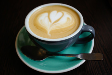 Cup with aromatic coffee with milk
