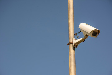 security camera on blue sky