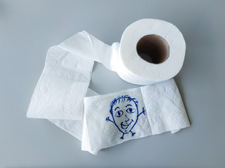 White toilet paper on a gray background