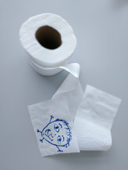 White toilet paper on a gray background