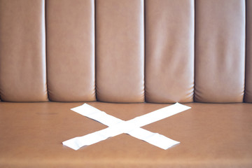 Seats are put symbol signages to help stop spreading coronavirus covid-19 for public health safety