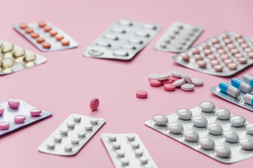 medicine tablets vitamins on the table in the group