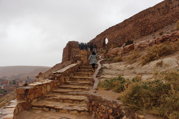 tourists climbing ben al haddou