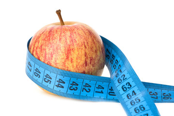 red apple and measuring tape