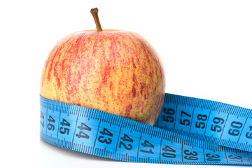 red apple with measuring tape isolated
