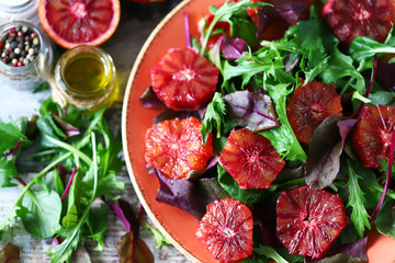 Super nutritious detox salad with red orange and mix of salads. Vegan diet. Diet food. Fitness nutrition.