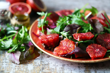 Super nutritious detox salad with red orange and mix of salads. Vegan diet. Diet food. Fitness nutrition.