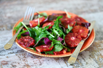 Super nutritious detox salad with red orange and mix of salads. Vegan diet. Diet food. Fitness nutrition.