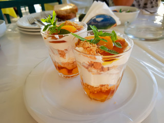 greek yoghurt, apricot and honey with crumbled biscuits and mint