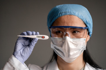 Doctor thermometer with high temperatures. Body temperature. Virus symptoms. Epidemic coronavirus...