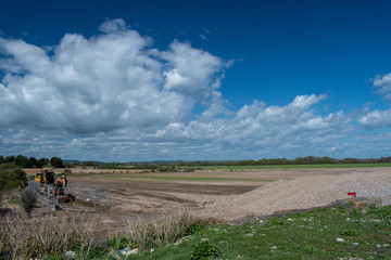 Digger and excavator used to build the new sea defence at Climping Beach, and a lovely view of the beautiful countryside and farmland in the background.