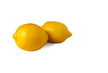 Lemons with green leaves isolated on white background