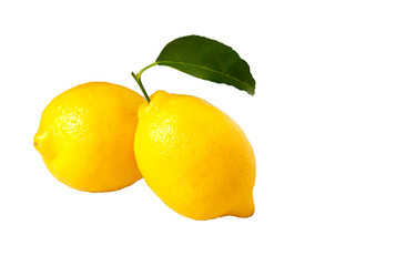 Lemons with green leaves isolated on white background