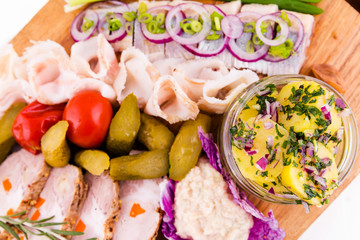 Russian traditional snack on a wooden board on a white background
