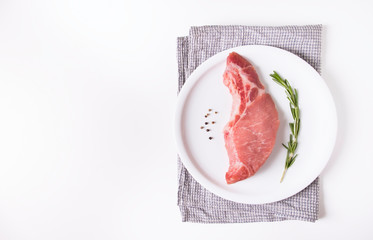 sliced raw pork meat on white background. Top view. Flat lay