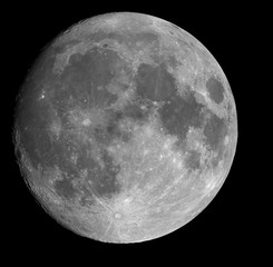 95% Full Moon over black sky.