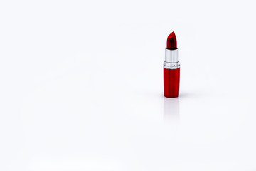 Red Lipstick on white background. Lipstick for professional make up with Copy Space. Lip care...