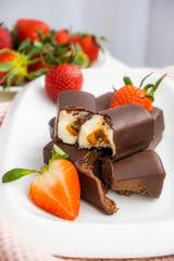 Glazed vegetable syrki. Homemade sweet cheesecakes with chocolate covered strawberries. Appetizing curd cheese. Chocolate Cheese.