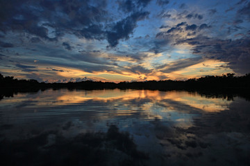 Fototapeta premium Colorful sunset and reflection on Nine Mile Pond after storm in Everglades National Park, Florida.