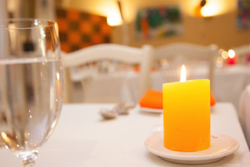 a fragrant candle on the dinner table.