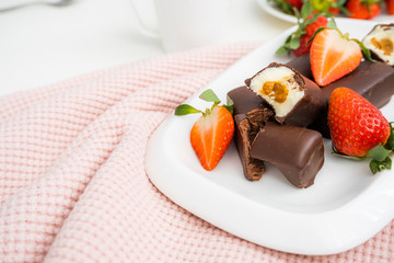 Dietary curd cheese. Dessert glazed curd cheese with strawberries.