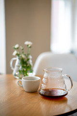 Black filter coffee on the table in cafe service kettle hario pour over cup