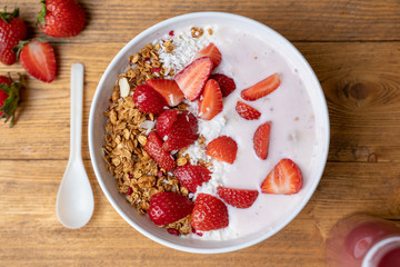 Breakfast with yogurt, granola, with superfood toppings, closeup view. Concept of healthy eating, healthy lifestyle