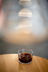 Black filter coffee on the table in cafe glass cup hario pour over cup