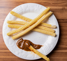 Churros With  Milk Sweet  In White Dish
Dulce de leche