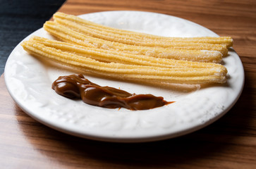 Churros With milk  Sweet In WHITE Dish
Dulce de leche