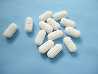 medicine pills on blue background