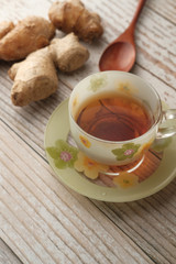 Ginger tea with ginger on table , high angle view .