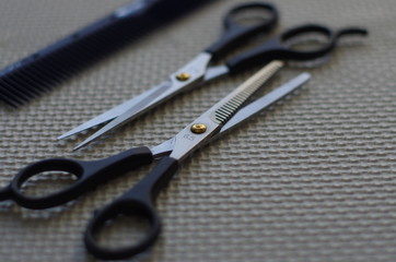 Working tools of barber master. Hair salon table with bokeh effect.