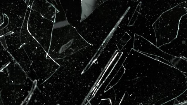 Super Slow Motion Shot of Real Glass Break at 1000 fps Isolated on Black Background.
