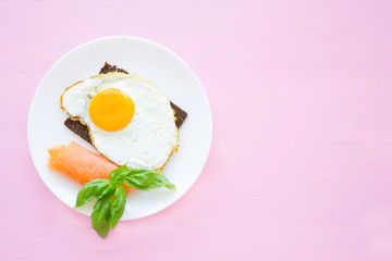 Toast with fried eggs and salmon  for lunch or brunch.