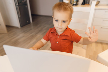 Schoolboy studying home during online internet lesson with computer. Concept education quarantine