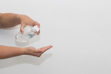 Concept of using sanitizer with copy space on white background.