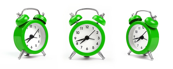 Three green alarm clock over white