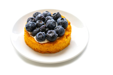 blueberry cake on a white plate. Isolate on a white background.