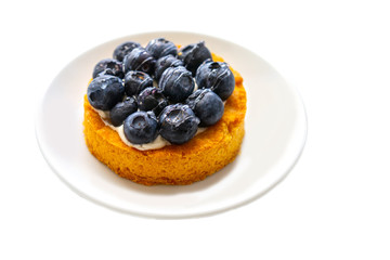 blueberry cake on a white plate. Isolate on a white background.